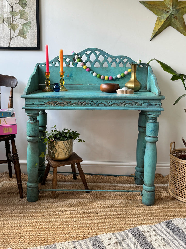 Turquoise Indian console table with carved detail