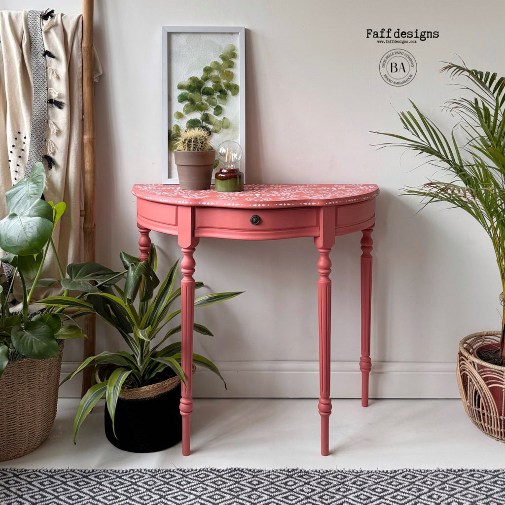 Pink demi lune table with stencilled top